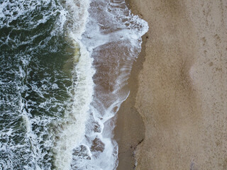Fototapeta na wymiar Waves and sand
