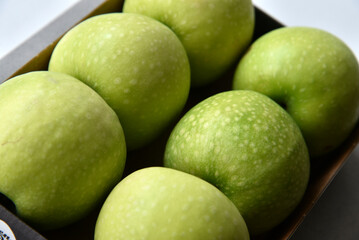 Green apples in the background close-up