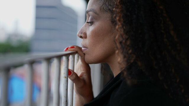 Person Observing The Street Outside From Home Balcony A Black Woman Spying Looking Out