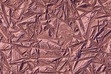 Beautiful colorful, bright and vivid chocolate background or texture of mud, slush or muck with ice in cold and frost winter weather