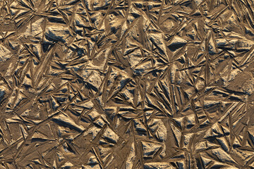 Beautiful colorful, bright and vivid background or texture of mud, slush or muck with ice in cold and frost winter weather