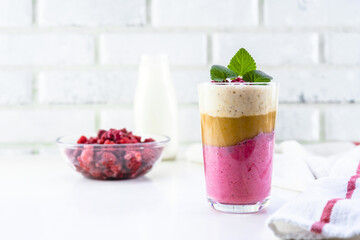 Delicious layered yogurt dessert with applesauce, raspberries and banana.