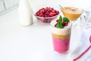 Delicious layered yogurt dessert with applesauce, raspberries and banana.