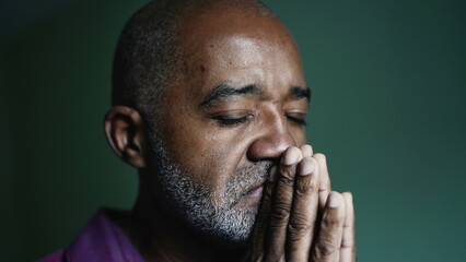 An older Brazilian man praying to God