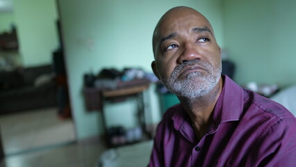A struggling pensive senior African man feeling anxious