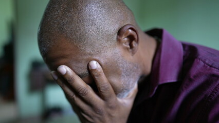 A struggling pensive senior African man feeling anxious