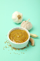 Concept of tasty food with sauce on mint background