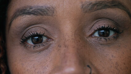 A black woman eyes close-up looking at camera macro closeup of person