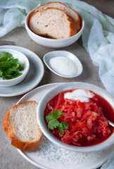 Red soup served with white bread. Tasty soup.