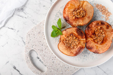 Delicious and healthy dessert of baked quince with nuts.