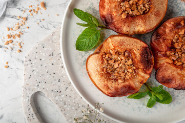 Delicious and healthy dessert of baked quince with nuts.