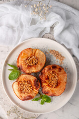 Delicious and healthy dessert of baked quince with nuts.