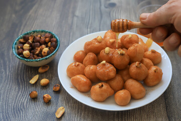 A bowl of Lokma (Turkish), loukoumades (Greeek ) with other names in other languages, are pastries...