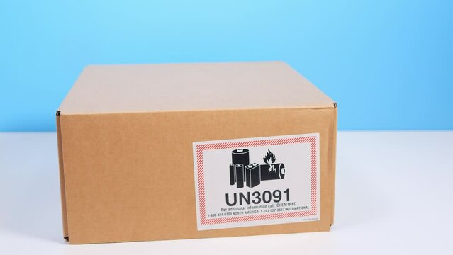 Courier delivery of goods with lithium metal batteries contained in equipment, or li ion batteries packed with the equipment (including lithium alloy batteries). Craft cardboard box with sign 'un3091'