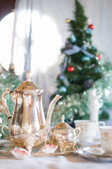 English tea party, silver tea set against the background of the Christmas 