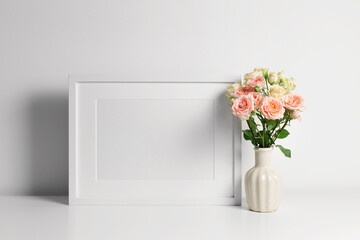 Frame mockup on white wall with copy space for artwork, photo or print presentation.