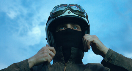 motorcyclist rides through a beautiful field