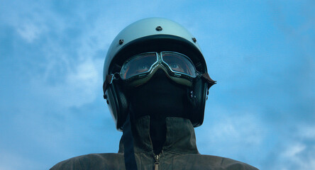 Fototapeta premium motorcyclist rides through a beautiful field