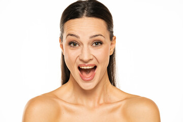 Beautiful shirtless happy woman with make up on a white