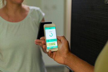 Close-up payment of food delivery with a smart phone