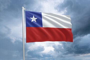 Fototapeta na wymiar Chilean flag on a flagpole waving in the wind on a cloudy sky background. Flag of Chile