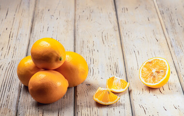 Fresh lemons fruitsm on wooden table. Wood background. A delicious fruit to prepare juice or water.