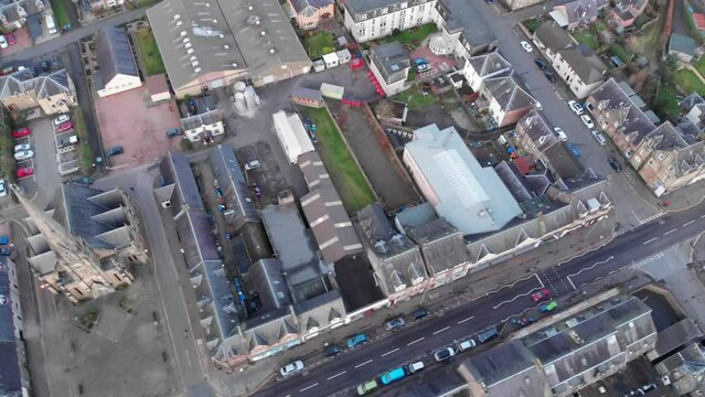 Drone footage. Flying over the center of Scottish town Callander