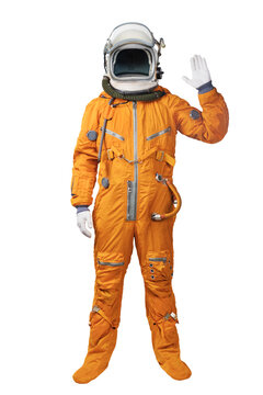 Hello Astronaut wearing an orange spacesuit and helmet waives hand in hello gesture isolated over white background. Unrecognizable astronaut gesturing Hi greeting isolated on white background