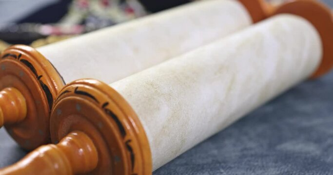 Jewish religious symbols with shofar tallit prayer book of torah scrolls a pointer in synagogue