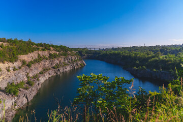 Fototapeta na wymiar Oktyabrsky granite quarry in Krivoy Rog. Flooded quarry. Rest near the water.