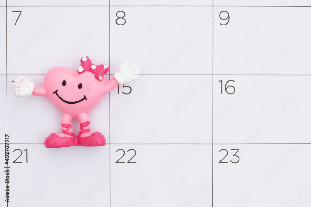 Wall mural calendar with a happy smiling heart for your fun or welcoming message