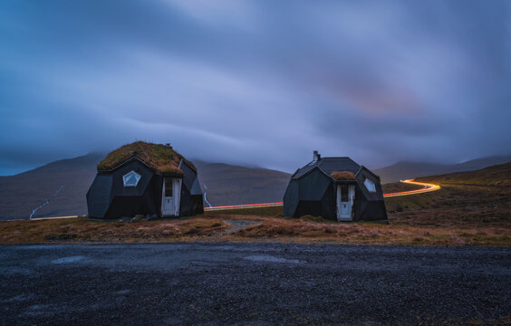 Kvivik Streymoy Faroe Islands, Denmark, Europe november 2021: Weird houses - two tiny geometric igloo homes with grass roofs on the hills. Most original houses and eco friendly in the world