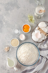 Ingredients for the preparation of challah bread dough, flour, water, sugar, eggs, yeast, oil, salt. Top view, copy space.