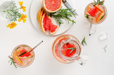 Grapefruits iced drink with rosemary. Top view