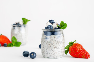 Chia seed yogurt pudding with berries, coconut and mint. Superfoods concept