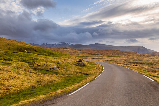 Asphalt road along the hills on Streymoy island. Faroe Island.