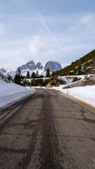 Passo Pordoi mountain pass road in the italian Dolomites near Cortina d'Ampezzo during winter