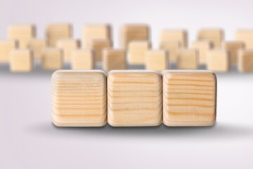 three wooden cubes with the letter on the bright surface. the inscription on the cubes