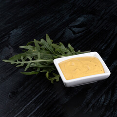 mayonnaise on a dark table, white sauce