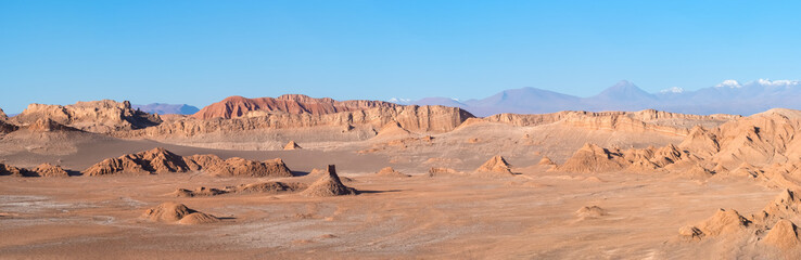 Stunning desert landscapes in the Valley of Moon (Valle de la Luna), San Pedro de Atacama, Chile. Unique rock formations, cliffs sand dunes with infinite color and texture variations. - obrazy, fototapety, plakaty