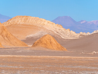 Stunning desert landscapes in the Valley of Moon (Valle de la Luna), San Pedro de Atacama, Chile. Unique rock formations, cliffs sand dunes with infinite color and texture variations.