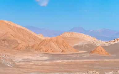 Stunning desert landscapes in the Valley of Moon (Valle de la Luna), San Pedro de Atacama, Chile. Unique rock formations, cliffs sand dunes with infinite color and texture variations.
