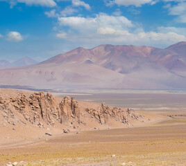 Monjes de la Pacana. Awe-inspiring geological formations in the shape of huge pillars said to be monks guarding the entrance to the Tara Salar (salt flat) and Pacana caldera