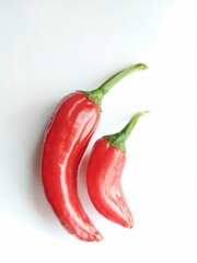 Red chillies on white background