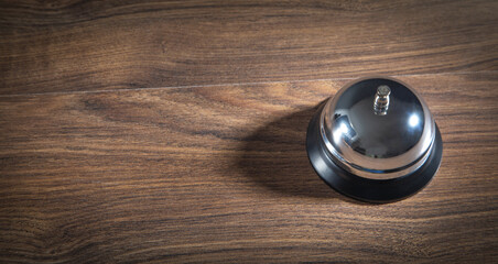 Service bell on the wooden table.