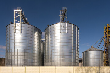 agro silos granary elevator on agro-processing manufacturing plant for processing drying cleaning and storage of agricultural products, flour, cereals and grain.