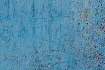 Metal texture with corrosion areas. Old and rusty surface structure of the metal painted with blue paint, high resolution.