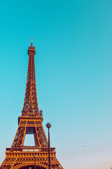 Naklejka na ściany i meble . The Eiffel Tower against a perfectly blue sky. Beauty travel in Paris, touristic place.