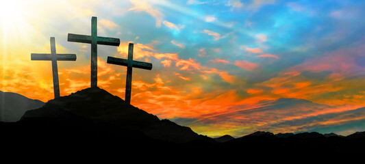 Fototapeta na wymiar Easter background banner panorama religious greeting card Crucifixion and Resurrection. Three crosses of Golgotha by sunset.