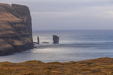 Risin og Kellingin rock formations on the coast of Streymoy Island, Eidi, Faroe Islands, Denmark.